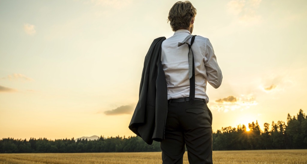 Man in a suit looking at the horizon