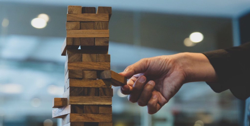 Person removing a jenga piece